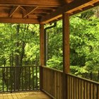 Thinkstock/Comstock/Getty Images Place deck boards perpendicular to the length of the deck.