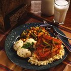 Jupiterimages/Comstock/Getty Images Pork chops and vegetables are healthy and satisfying.
