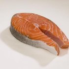 Jupiterimages/Comstock/Getty Images Salmon contains omega-3 fatty acids that can help improve your child's focus.