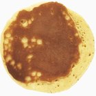 George Doyle/Stockbyte/Getty Images Holes in pancakes are caused by carbon dioxide bubbles.