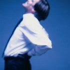 Stockbyte/Stockbyte/Getty Images Poor posture when standing can lead to excruciating back pain.