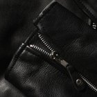Thomas Northcut/Photodisc/Getty Images Remove sticker residue with care to keep the leather intact.