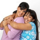 Visage/Stockbyte/Getty Images A loving mother shows her children affection.