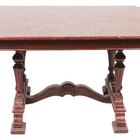 Hemera Technologies/PhotoObjects.net/Getty Images Fill a gouge in your mahogany table with a wax fill stick.