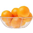 Thinkstock/Comstock/Getty Images Minature oranges can provide fresh citrus even in areas that experience frost.