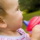 Jupiterimages/Pixland/Getty Images Familiarity with a sippy cup can ease the transition to using one instead of a bottle.