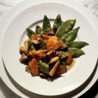 Eising/Photodisc/Getty Images Stir-fry beef with snap peas and other vegetables.
