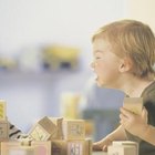 Comstock/Comstock/Getty Images Toddlers may argue over and snatch toys such as blocks.