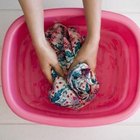 Jupiterimages/Polka Dot/Getty Images Hand wash wool pants in cool water.