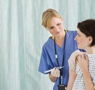 Jupiterimages/Polka Dot/Getty Images Insurance costs and medical bills can be distributed in a divorce.
