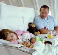 Digital Vision/Digital Vision/Getty Images Moving to another country with a child may violate state, federal or international law.