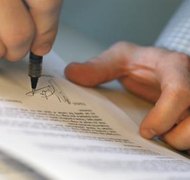 Medioimages/Photodisc/Photodisc/Getty Images A signed settlement or court order usually explains an ex-husband's financial obligations.