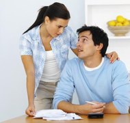 Stockbyte/Stockbyte/Getty Images It is necessary to have a honest coversation with your potential spouse about your finances.