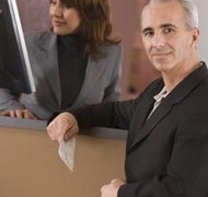 Jupiterimages/Comstock/Getty Images An executor must pay all valid claims against the estate.