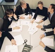 BananaStock/BananaStock/Getty Images Successor companies often come about through complex negotiations.
