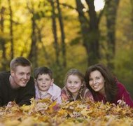 Jupiterimages/Comstock/Getty Images Step-parents may provide financial and emotional support.