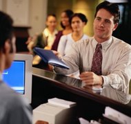 Keith Brofsky/Photodisc/Getty Images You can open a business bank account if you operate your business under a DBA name.