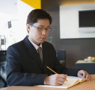 Jupiterimages/Comstock/Getty Images Corporate minutes are often initially prepared in handwritten form.