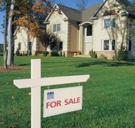 Comstock/Comstock/Getty Images An executrix may sell real estate with proper authority.