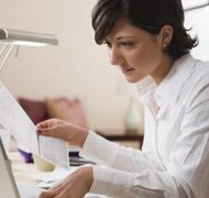 Jupiterimages/Comstock/Getty Images Banking records are useful in preparing a will.