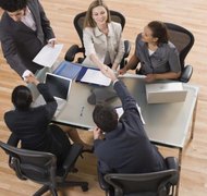 Jupiterimages/Comstock/Getty Images Add buy-sell provisions to an operating agreement to prepare for a buyout of a member.