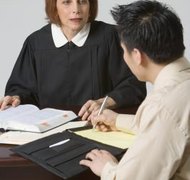 Jupiterimages/Creatas/Getty Images The court enters the final divorce decree after it is signed by the judge.