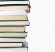 Jupiterimages/Comstock/Getty Images The authors of books automatically hold the rights to their material.