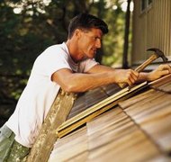 Comstock/Comstock/Getty Images An executor's duties may include hiring a contractor to maintain property.