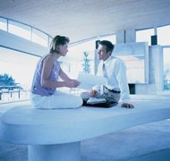 Photodisc/Photodisc/Getty Images Divorcing couples must determine how to resolve their outstanding mortgage debt.