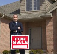 Jupiterimages/liquidlibrary/Getty Images If divorcing couples cannot agree on who gets to keep the family home, it may be sold.