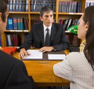 Pixland/Pixland/Getty Images Spouses can try to negotiate a divorce agreement with a lawyer or mediator.