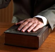 Brand X Pictures/Brand X Pictures/Getty Images Lying under oath is a crime in all 50 states.