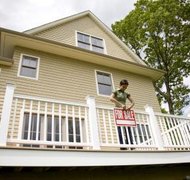 David Sacks/Lifesize/Getty Images Surrendering a home during Chapter 13 bankruptcy can relieve debt.