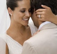Jupiterimages/Goodshoot/Getty Images Marriage and a new name may require a new green card.