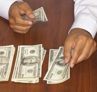 Burke/Triolo Productions/Brand X Pictures/Getty Images You can be required to pay your spouse money while your divorce is pending.