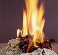 Jupiterimages/Photos.com/Getty Images A trustee's bankruptcy could burn up trust assets belonging to the trust's beneficiaries.