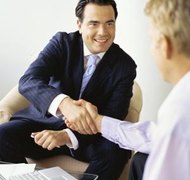 George Doyle/Stockbyte/Getty Images A handshake is not sufficient to create a binding contract.
