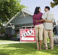 Jupiterimages/Brand X Pictures/Getty Images Filing bankruptcy doesn't necessarily mean losing your land.