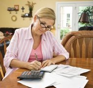 Jupiterimages/Comstock/Getty Images Review the deceased's bank statements to confirm you've returned unearned benefits.