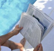 Creatas Images/Creatas/Getty Images In Florida, you can use the newspaper to let your missing spouse know you're divorcing him.