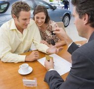Polka Dot Images/Polka Dot/Getty Images You can repay a car loan within or outside of a Chapter 13 bankruptcy plan.