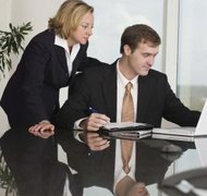 Jupiterimages/Comstock/Getty Images Completing two easy forms registers your LLC for employer and tax purposes in New Jersey.