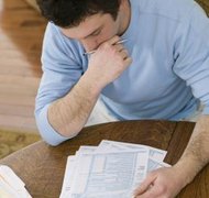 Comstock Images/Comstock/Getty Images To keep your tax refund in bankruptcy, you'll have to find an exemption.
