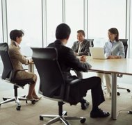Ryan McVay/Digital Vision/Getty Images You and your spouse can reach a settlement during a pretrial conference.