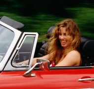Jupiterimages/Photos.com/Getty Images Just because your wife won the car in your divorce doesn't automatically mean that it's no longer your concern.