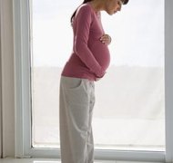 Creatas Images/Creatas/Getty Images A pregnant spouse can cause a Kentucky court to stay divorce proceedings.