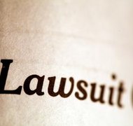 Jupiterimages/Photos.com/Getty Images Filing a bankruptcy petition halts a civil lawsuit in Illinois.