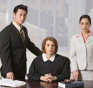Jupiterimages/Creatas/Getty Images The judge will rule on all motions and cross-motions filed by each side.