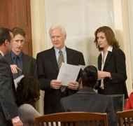 Jupiterimages/Photos.com/Getty Images Litigation can drive a debtor into bankruptcy.