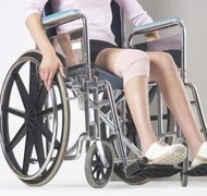 Hemera Technologies/AbleStock.com/Getty Images Spouses with multiple sclerosis may receive support to help pay for medical expenses.